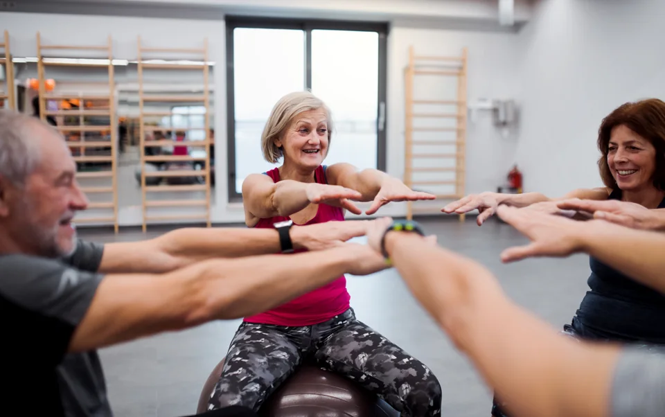 Adults exercising together in a gym